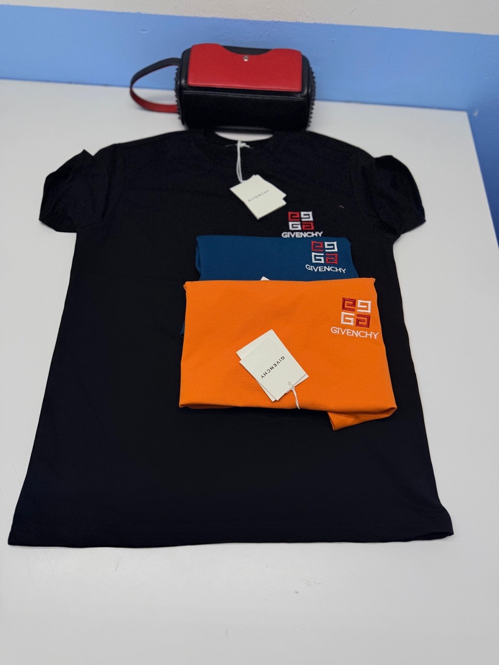 Givenchy Kids Black Tee with Orange & Blue Logo Accents